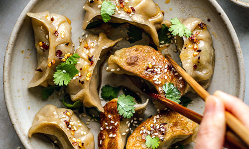 Small steamed dough pockets filled with green soy beans